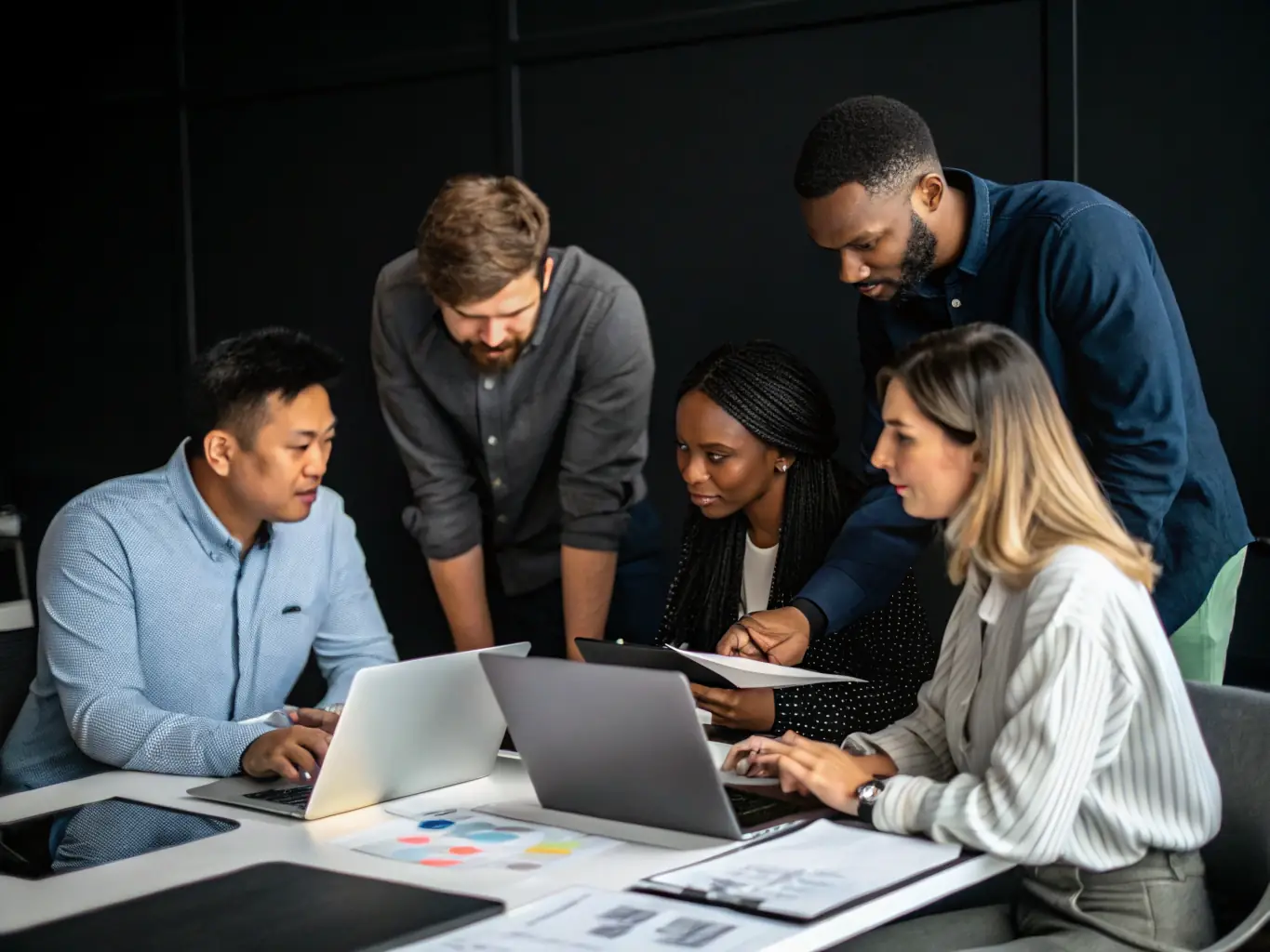 A diverse team of IT professionals collaborating on a ServiceNow administration task, showcasing DigiOnez's expertise and support capabilities.